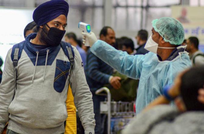 Personnel checking corona. Photo: PTI