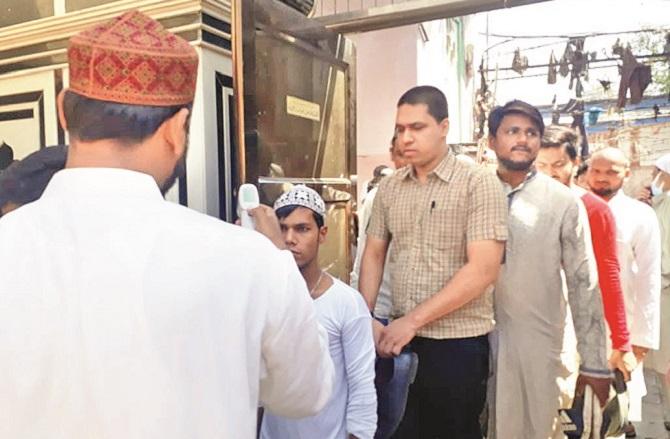 Volunteer outside the mosque testing. Photo: Inquilab