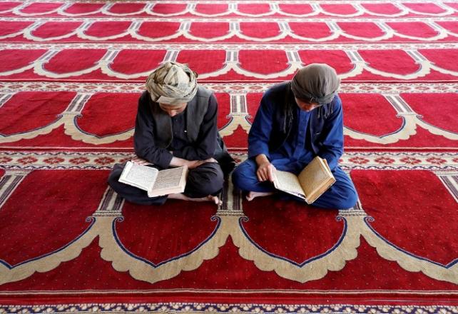 reciting holy quran in mosque