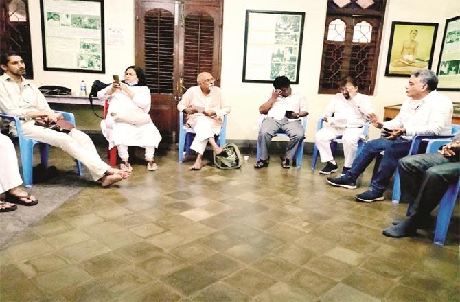 Social workers can be seen meditating during a meeting in Mumbai`s Sarvodia Mandal.Picture:Inquilab