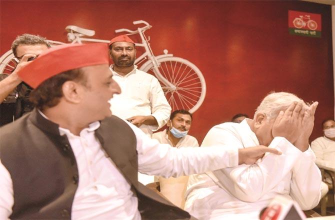 Former UP Chief Minister Akhilesh Yadav during the induction of Sibghatullah Ansari and Ambika Chaudhry into the party. (Photos: PTI)