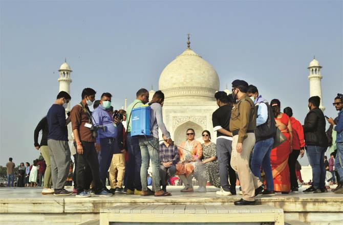 Sanitization in front of Taj Mahal. (PTI)