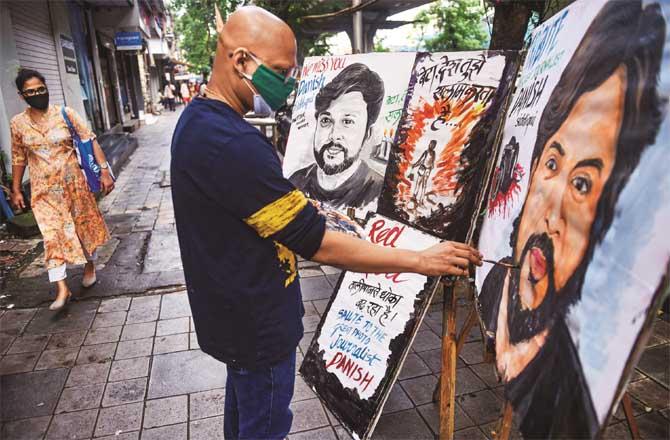 An artist paints Danish Siddiqui. Picture: PTI