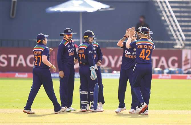 Indian players cheer on each other after dismissing the Sri Lankan batsman.Picture:PTI