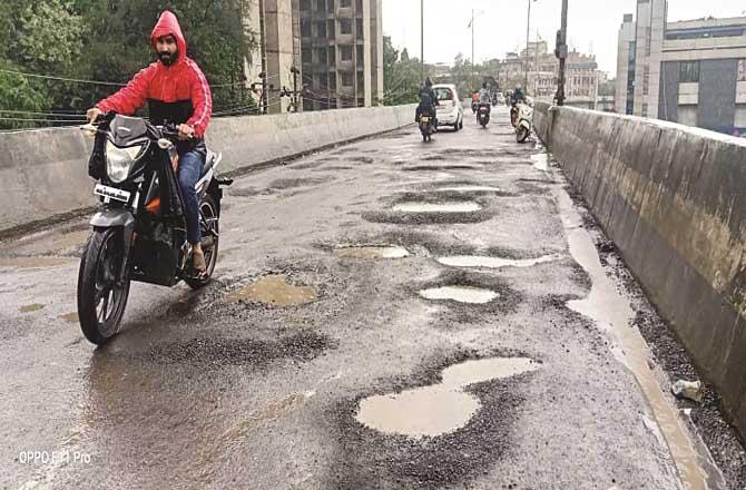 Many motorcyclists have lost their lives in accidents due to potholes on Rajiv Gandhi flyover.Picture:Inquilab