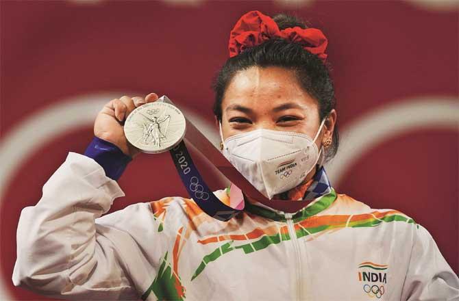 26-year-old Meera Bai Chanu celebrates after winning a silver medal. (Photo: PTI)