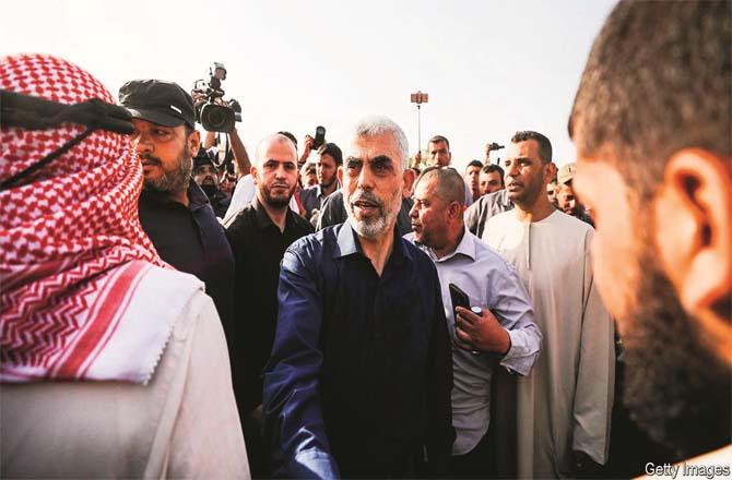 Hamas leader Yahya Sanwar among his supporters (file photo)