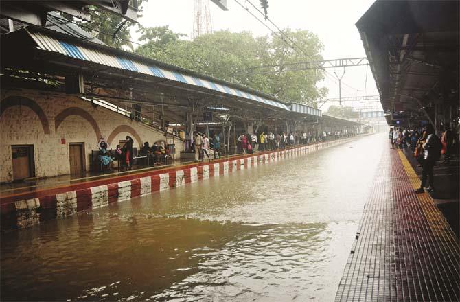 The sign station train tracks appear to be submerged in water.Picture:Inquilab