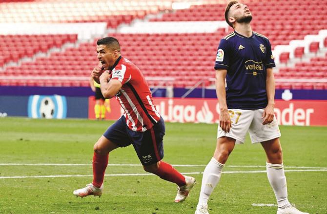 Atletico Madrid key scorer Luis Suarez (red jersey) looks excited.Picture:PTI