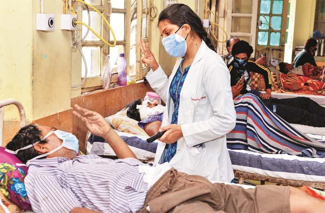 A doctor examines a black fungus patient at a hospital in Jabalpur.Picture:PTI