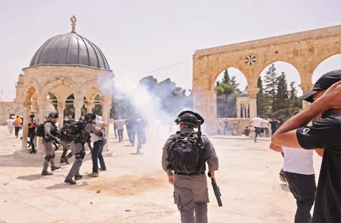 Zionist army fires tear gas near Al-Aqsa Mosque, while one person is being arrested.Picture:PTI