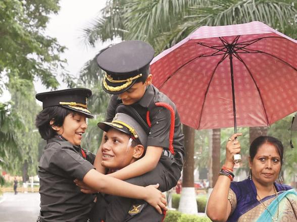 Officer Jyoti Nainwal with her children.Picture:PTI