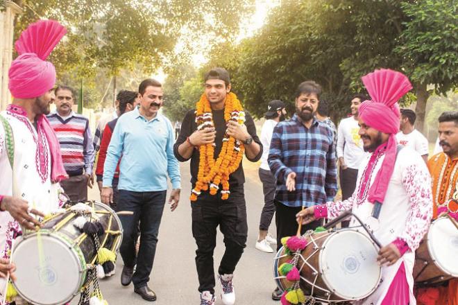 Olympic gold medalist Neeraj Chopra (left) received a warm welcome.Picture:PTI