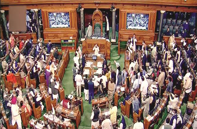 The bill was introduced in the Lok Sabha at 12:06 a.m. and passed by voice vote at 12:10 a.m. during opposition protests. (PTI)
