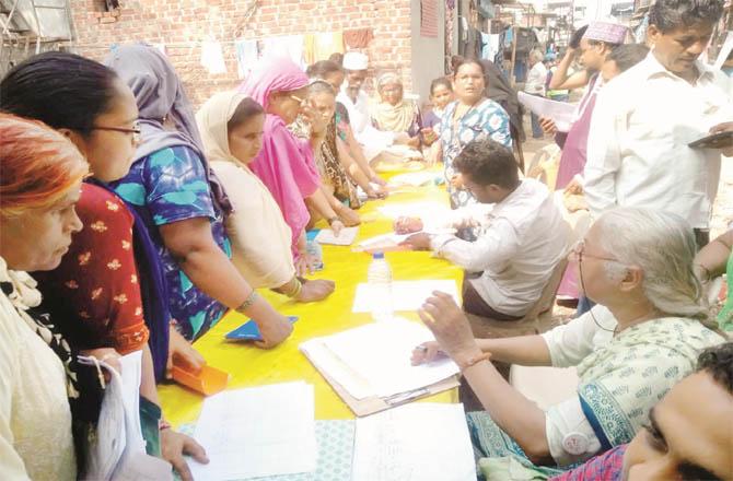 People filing complaints in the presence of Medha Patkar (right)
