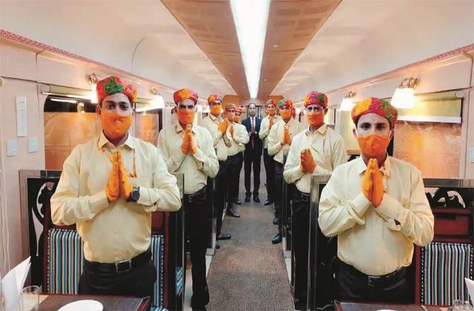 Ramayana Express staff in saffron uniforms that have been changed. Staff members can be seen in new uniforms.