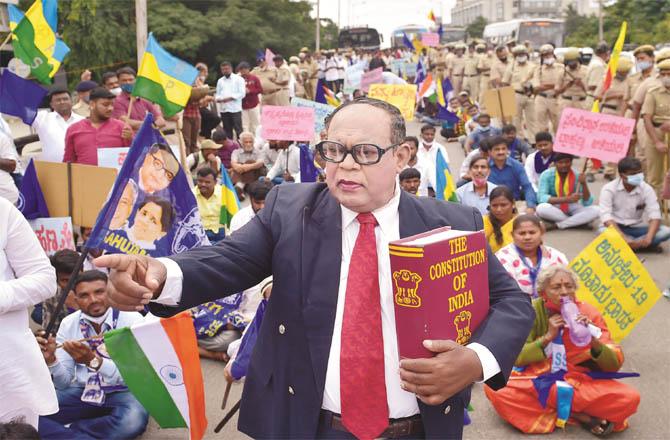 A man wearing a Dr. Ambedkar`s mask at a Constitution Day rally in Bangalore.