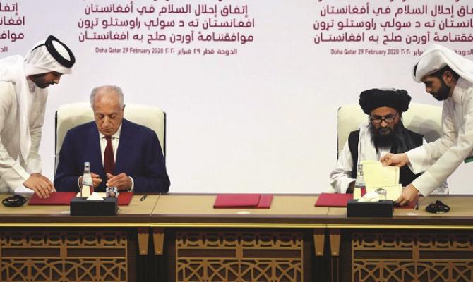  Zalmai Khalilzad (sitting left) was instrumental in negotiating with the Taliban.Picture:INN