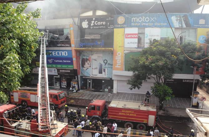 The fire in the mall was brought under control after 3 hours of hard work.Picture:Inquilab