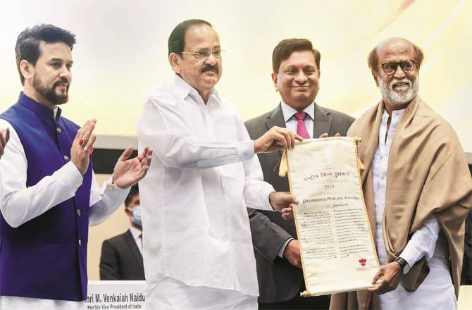 Vice President venkaiah Naidu conferring Dada Sahib Phalke Award on Rajni Kant. (PTI)