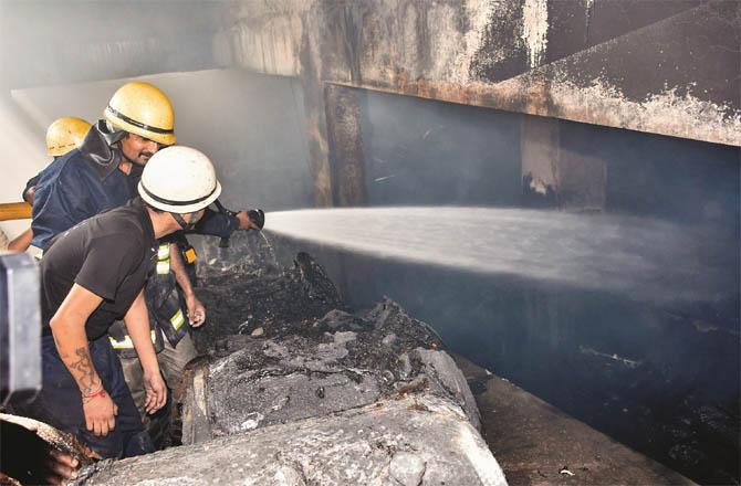 Firefighters try to put out a fire at the Surat factory (Photo: PTI)