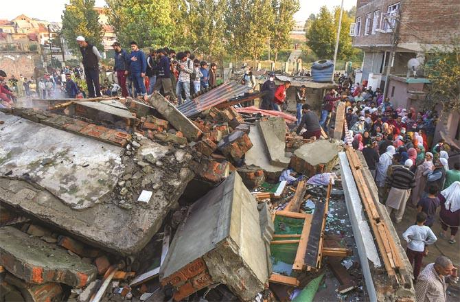 The house in which the militants were hiding was destroyed in the shelling. (PTI)