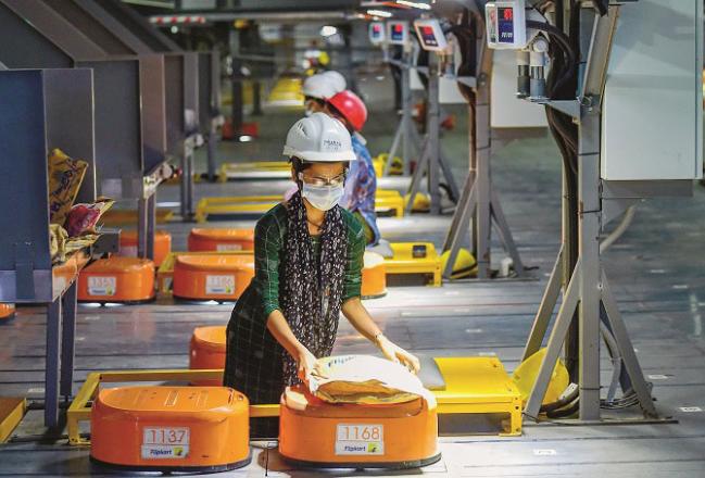  An employee packs at a flipkart company in Bangalore.Picture:INN