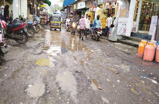 Pits can be seen on the road of an important market of Bhiwandi.Picture:Inquilab