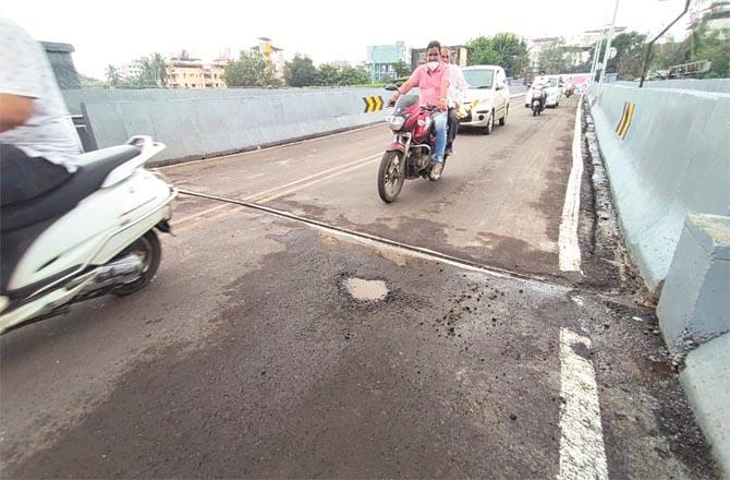 Pits can be clearly seen on Dombivli`s Cooper Bridge in just 48 hours after the inauguration.Picture:Inquilab
