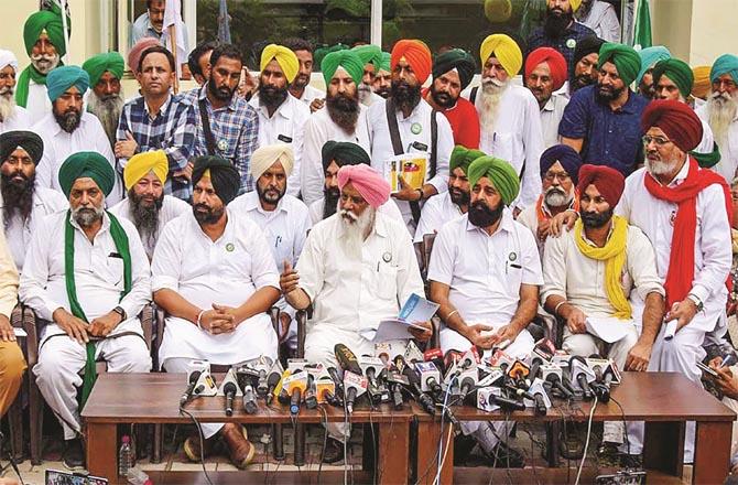 Addressing a farmers press conference in Chandigarh. (PTI)
