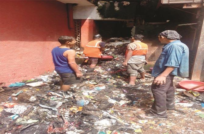 Many years old garbage of House Street is being cleaned.Picture:Inquilab