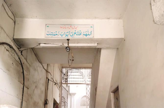 A CCTV camera is seen at the entrance of a mosque.