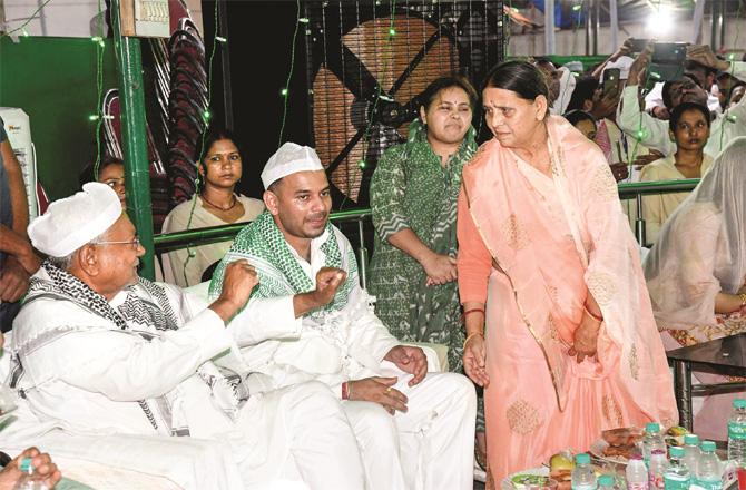 Nitish Kumar, Tejsui and Tej Pratap were sitting with Yadav at the Iftar party at Korabari Devi`s residence on Friday. (PTI)