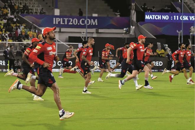 Punjab Kings players can be seen practicing on the field.Picture:BCCI