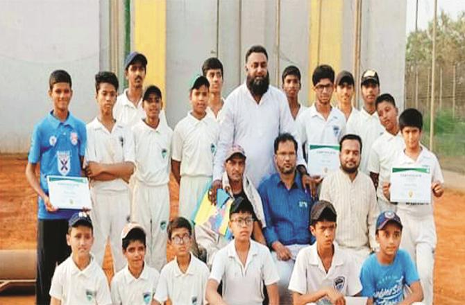 Ittehad Cricket Academy players and coaches. Among them, players selected for MCA Summer Camp are showing their certificates.