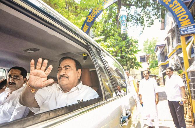 Eknath Kharsa leaving his car after filing the statement. (PTI)