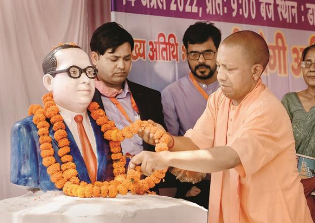 Yogi Adityanath is wearing a necklace on the statue of Babasaheb..Picture:PTI