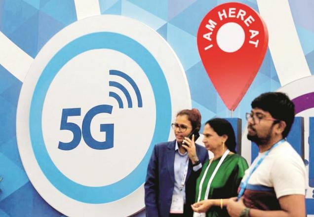 People near a counter set up for the trial of 5G Service at a telecommunications expo..Picture:INN