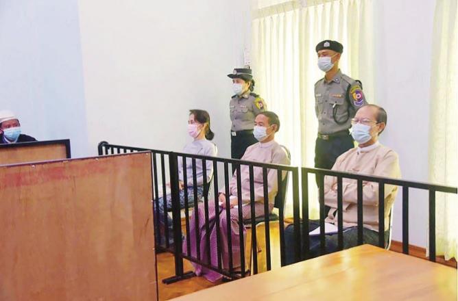 This photo released by Myanmar`s military government shows Aung San Suu Kyi and other leaders during court proceedings..Picture:INN