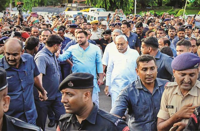 Bihar Chief Minister Nitish Kumar and RJD leader Tejashwi Yadav on their way to meet the Governor