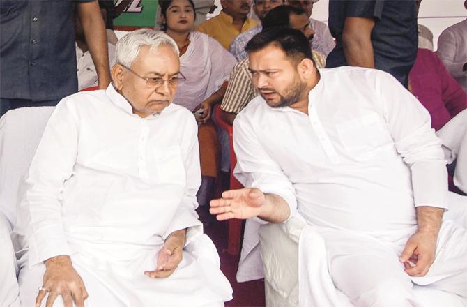 Deputy Chief Minister Tejashwi Yadav discussing an important issue with Chief Minister Nitish Kumar. (Photo: PTI)