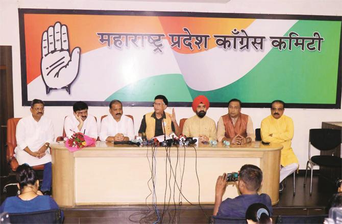 Pawan Khera and other Congress leaders can be seen during the press conference.