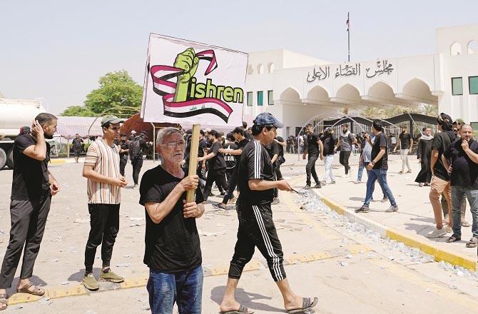 Protesters can be seen outside the Supreme Judicial Council in Iraq..Picture:Agency