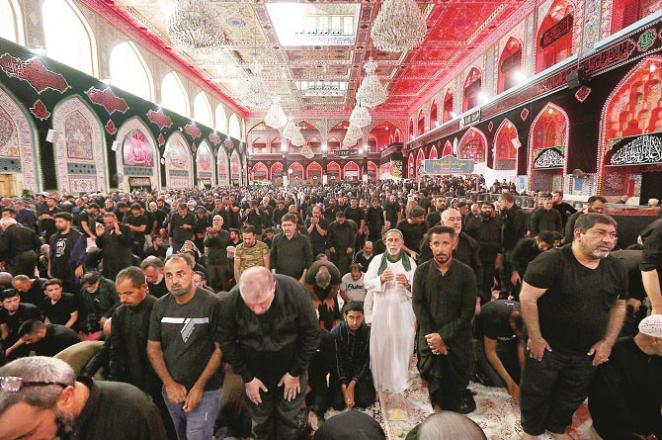  Pilgrims are engaged in prayers in a mosque adjacent to Imam Hussain`s grave in Iraq..Picture:Agency