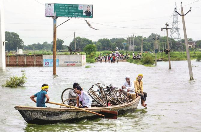 This picture is from Allahabad where people are migrating due to flood