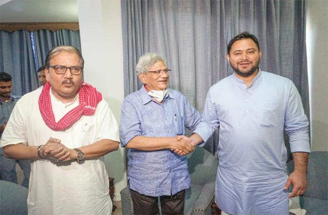 Tejaswi Yadav and Sita Ram Yechury after the meeting. Manoj Kumar Jhadekhe can be seen with them