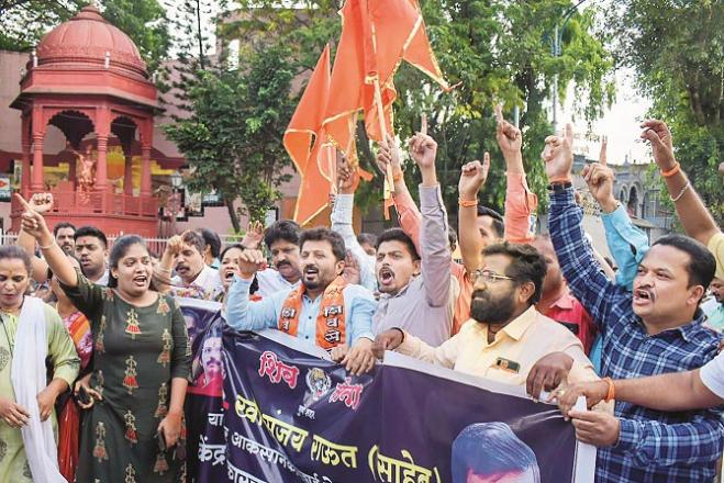  Shiv Sena workers raise slogans against ED action in Pune.Picture:PTI