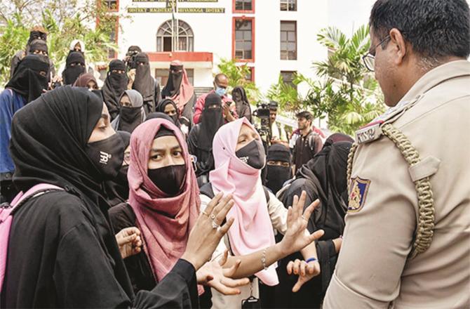 Hijab-wearing students fighting for their rights.