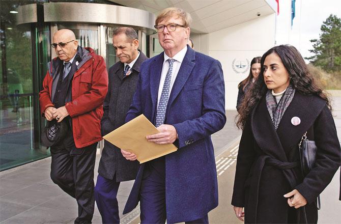 Al Jazeera lawyer Rodney Dixon with Abu Akleh  niece Lena at the Hague court.