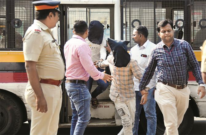 Police personnel taking the accused to court. (Photo: PTI)